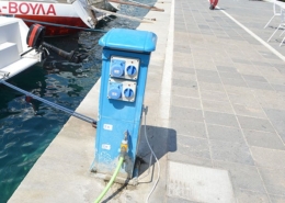 Marina power and water pedestal on the dockside, providing essential utilities for docked boats and yachts.