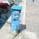 Marina power and water pedestal on the dockside, providing essential utilities for docked boats and yachts.