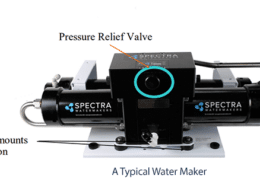 Spectra Watermakers device with pressure relief valve and vibration-absorbing rubber mounts for efficient sailing desalination.