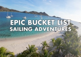 Sandy Island beach with yachts on turquoise sea, promoting Epic Bucket List Sailing Adventures text overlay.