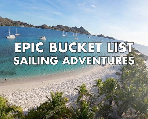 Sandy Island beach with yachts on turquoise sea, promoting Epic Bucket List Sailing Adventures text overlay.