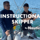 Two men discussing sailing techniques on a sailboat, part of NauticEd's Instructional Skipper program.