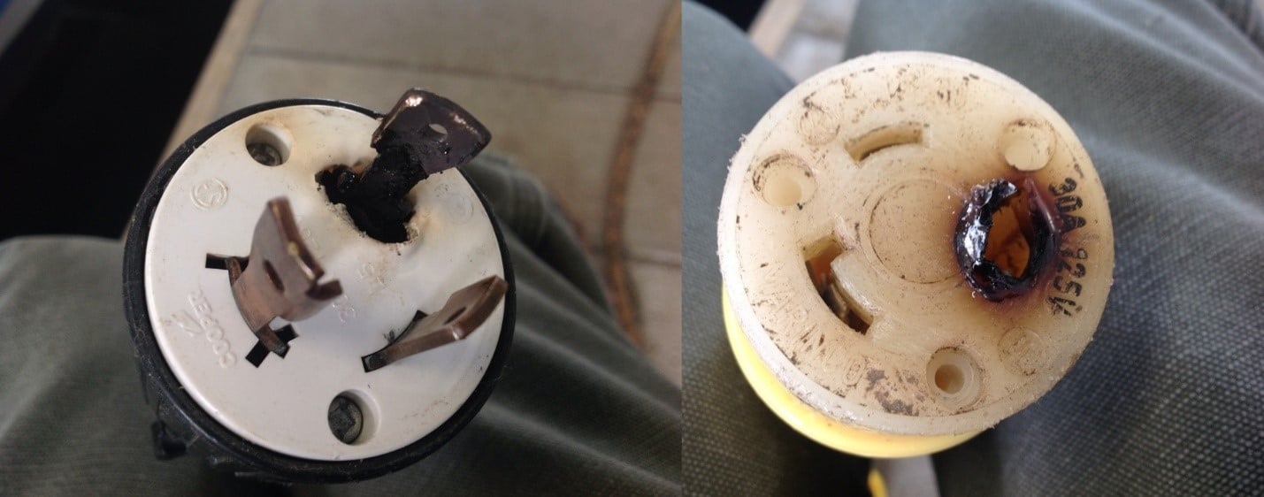 Damaged boat shore power plug and socket, showing signs of overheating and burn marks for inspection.