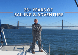 Man standing on sailboat with Golden Gate Bridge in the background, celebrating 25+ years of sailing adventure.