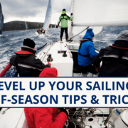 Sailors braving rough seas during off-season with Level Up Your Sailing: Tips & Tricks text overlay.