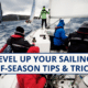 Sailors braving rough seas during off-season with Level Up Your Sailing: Tips & Tricks text overlay.