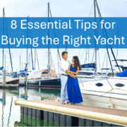 Couple standing by yachts in marina, showcasing essential yacht buying tips for boaters.