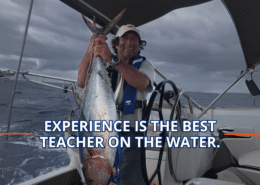 Sailor proudly holds a large fish on a yacht, showcasing a maritime catch under cloudy skies. Text: Experience is the Best Teacher.