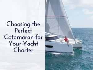 Catamaran sailing on open sea under blue sky with text: Choosing the Perfect Catamaran for Your Yacht Charter.