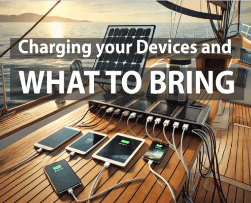 Devices charging on a sailboat deck with a solar panel, illustrating what to bring for tech convenience while sailing.