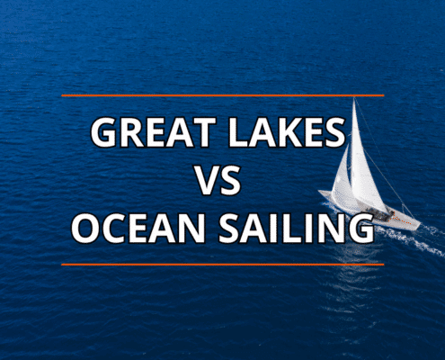 Great Lakes vs Ocean Sailing: A sailboat glides across blue water, exploring diverse sailing experiences.