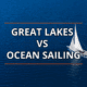 Great Lakes vs Ocean Sailing: A sailboat glides across blue water, exploring diverse sailing experiences.