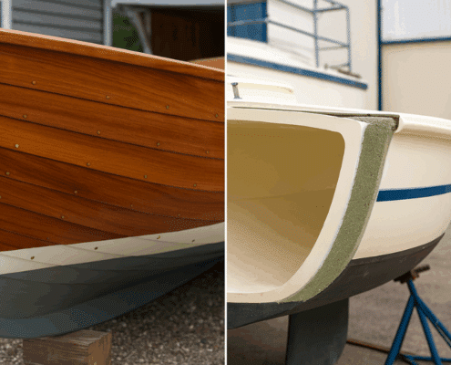 Close-up of elegant wooden and fiberglass sailboat hulls showcased outdoors, highlighting craftsmanship and design.