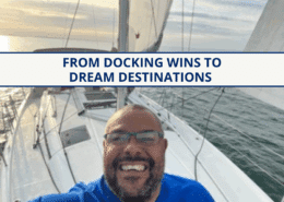Smiling sailor on a sailboat at sea, enjoying a scenic cruise under a clear sky.