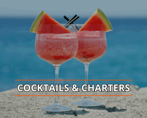 Frozen cocktails with watermelon slices on a rock by the sea, text overlay Cocktails & Charters.