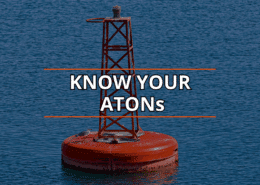 Red navigation buoy on calm water: Know Your ATONs for safe sailing.