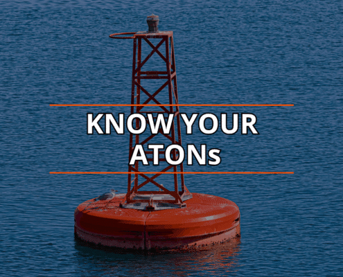 Red navigation buoy on calm water: Know Your ATONs for safe sailing.