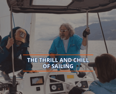Sailors navigating a boat under cloudy skies, embracing the thrill and calm of a scenic sailing adventure.