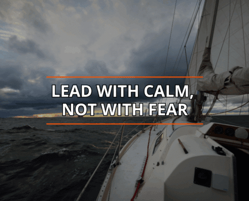 Sailing quote over a stormy sea, Lead with calm, not with fear, inspiring leadership and courage.