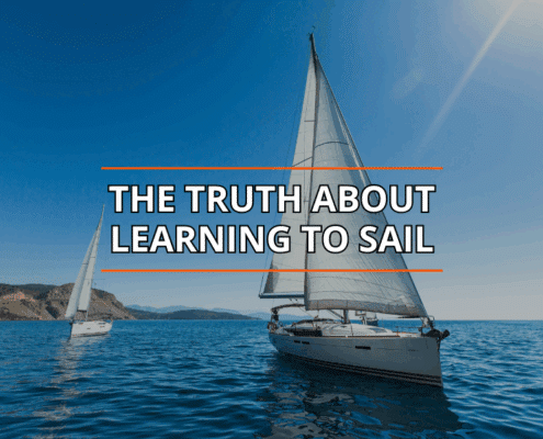Sailboats gliding on blue water under clear skies; text reads The Truth About Learning to Sail.