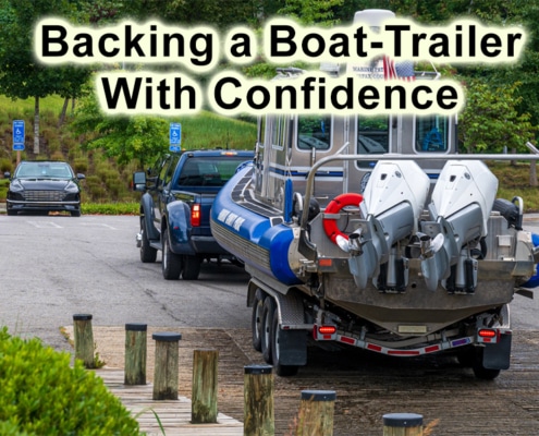 Truck expertly backs boat trailer into water at launch ramp, showcasing effective maneuvering skills for boaters.