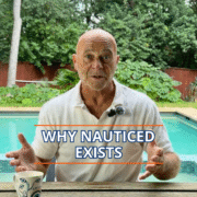 Why NauticEd Exists Man explaining Why NautiCED Exists by a pool, holding a coffee cup, with greenery in the background.