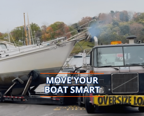 Truck transporting sailboat on road, sign reads Oversize Load, with Move Your Boat Smart text overlay.