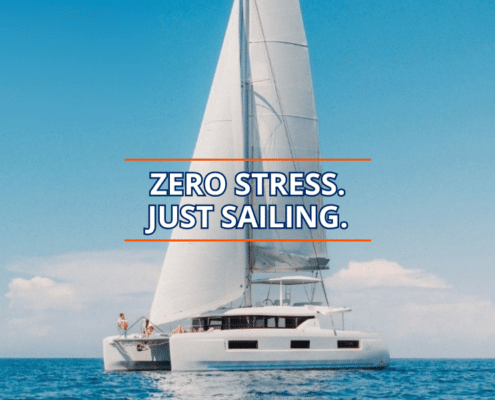 Catamaran sails smoothly on a clear day, embodying the phrase Zero Stress. Just Sailing.