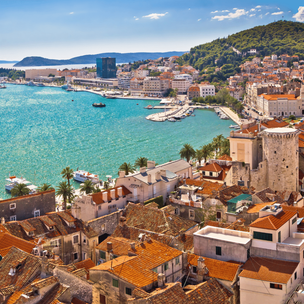 blog-below-deck-destinations-2-Dalmatian Coast Scenic view of Split, Croatia's coastal harbor, featuring turquoise waters, sailboats, and historic architecture.