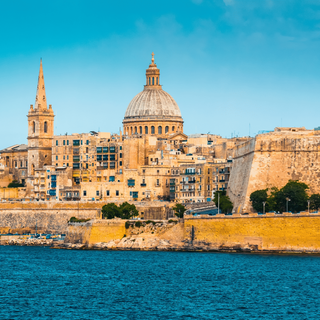 blog-below-deck-destinations-7-Malta Scenic view of Valletta, Malta from the sea, featuring historic architecture and a vibrant blue sky.
