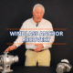 Man demonstrating windlass anchor recovery techniques with equipment on a table.