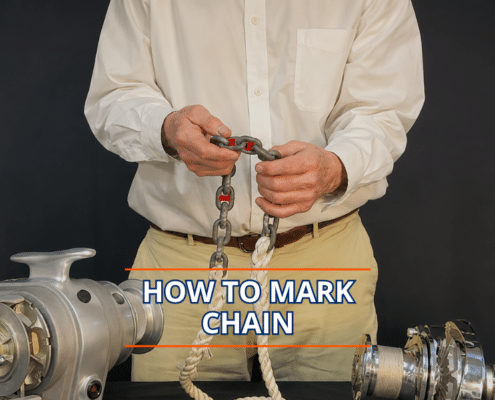 Man demonstrating how to mark an anchor chain, with boat equipment in view.