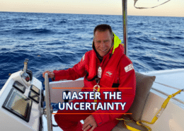 Sailor in red gear steering on open sea with text Master the Uncertainty.