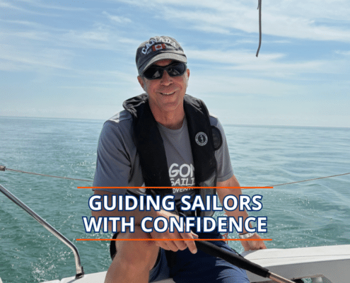 Experienced sailor steering a boat under blue skies, promoting sailing confidence and skills.