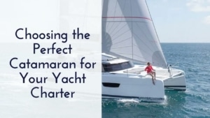 Catamaran sailing on the ocean with a person on deck; guide to choosing the perfect yacht charter.